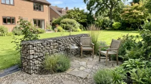 Gabion wall defining a backyard seating area without enclosing the entire yard